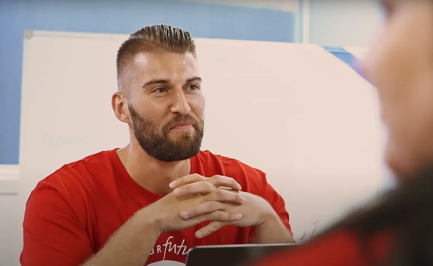 Asher in a team workshop, listening